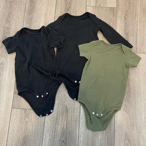 Three infant onesies by Primary.